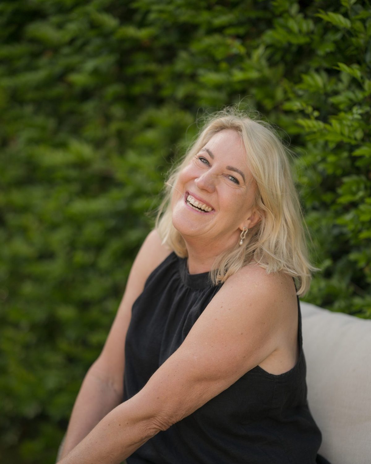 Debbie laughing in the garden