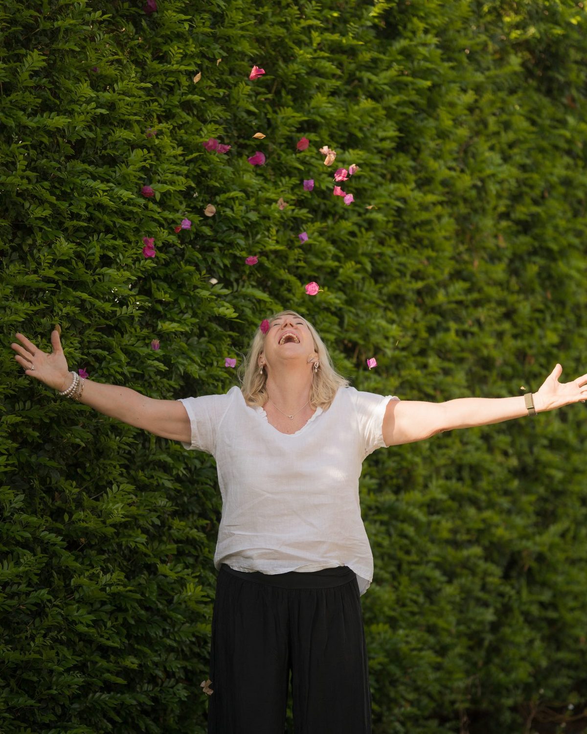Debbie throwing petals into the air